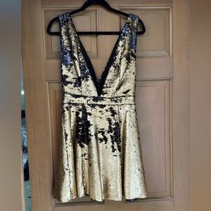 Like new NBD gold and black sequin mini dress size medium